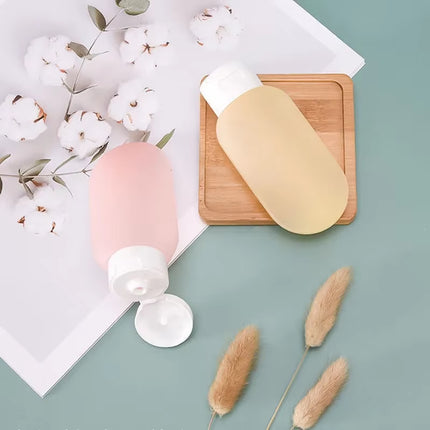 Set de 4 Botellas de Viaje Rellenables 60 ml | Plástico Flexible para Champú, Loción y Cosméticos